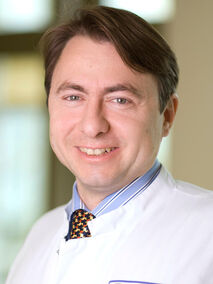 Portrait von Dr. med. Alexander Scheuerle, FEBO